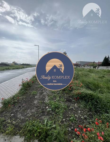 Plots - housing on Bučuháza Street in Šamorín, by the road with greenery and poppies.
