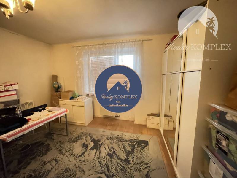 Cozy room in a family house with carpet and furniture, floor with wooden decor.