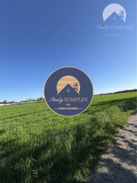 Plots - housing in Kostolné Kračany with open countryside and blue skies.