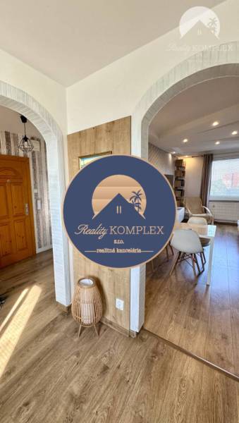 Interior of a 4-room apartment with wooden floors and arched doorways.