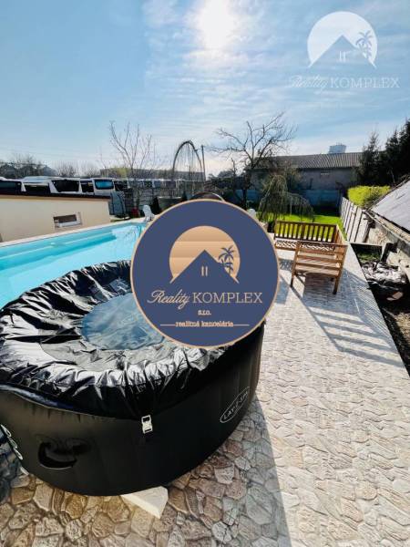 There is a jacuzzi next to the pool on the terrace in the family house.