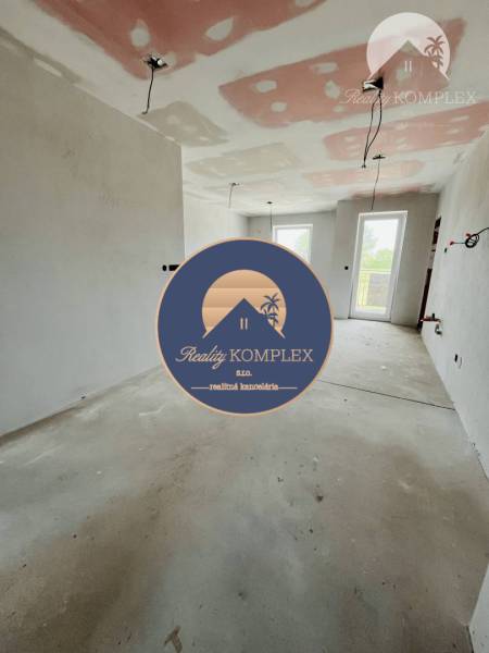 The interior of an unfinished 3-room apartment with evident preparation for electrical installation.