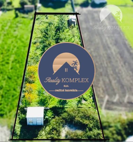 Aerial view of a residential plot in Veľký Meder with lush vegetation.