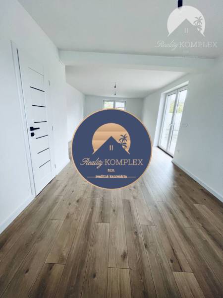 A family house with white walls and a floor with a wood decor.