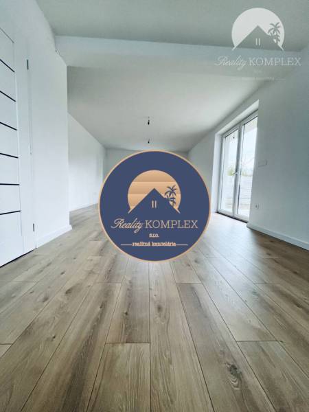 Interior of a family house with a wooden decor floor and French windows.