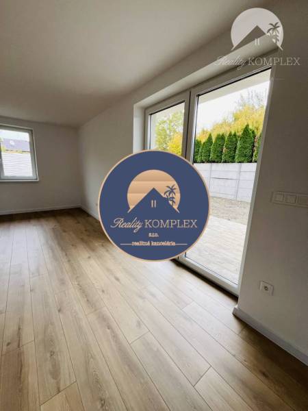 Interior of a family house with windows and a wooden decor floor.