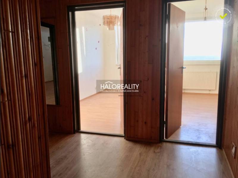 Interior of a 4-room apartment with a wooden decor floor and bright rooms.