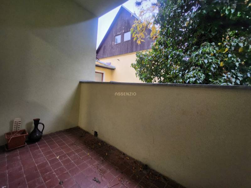 Balcony of a 2-room apartment with greenery, view of the surrounding architecture from Dolná Street.