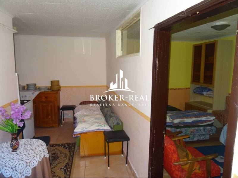 Interior of a family house with furniture, a sofa, and decorations on the table.