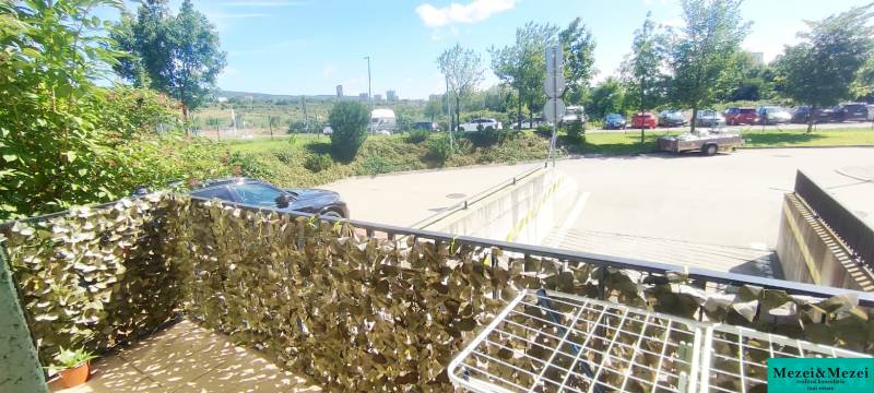 Balcony in Bratislava - Krasňany with a view of greenery and a parking lot, 1-room apartment.