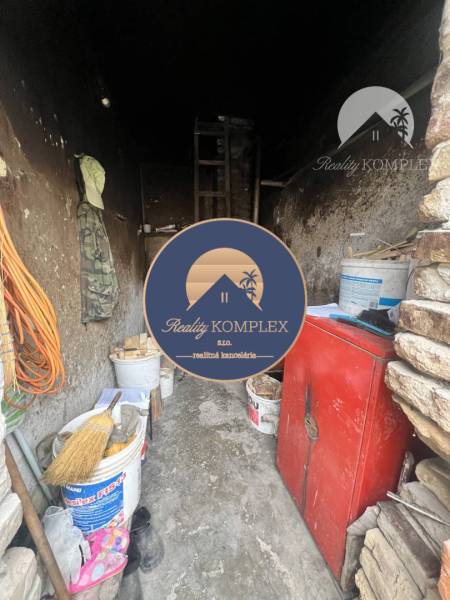 Storage space in a family house with old furniture and various storage needs.