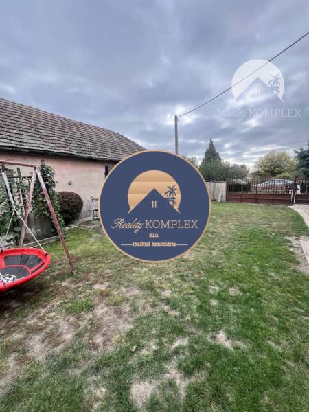A family house on Pavla Street in Komárno with a grassy yard and a swing.