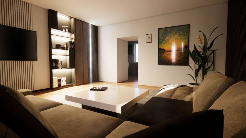 Living room in a family house with a sofa, a plant, wood-patterned flooring, and modern art.