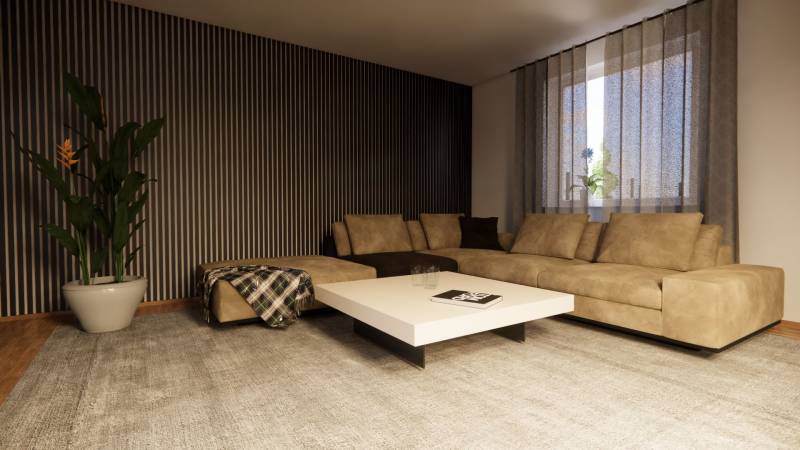 A cozy living room in a family house with a beige sofa and a potted plant.