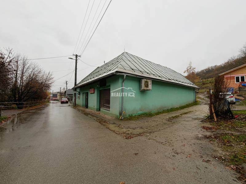A street with a family house in Kolárovice, dreary autumn weather.