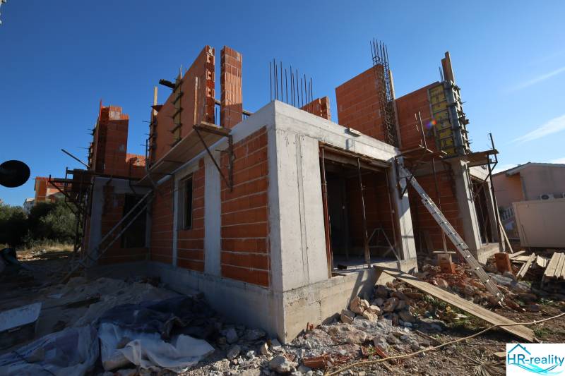 A recreational apartment in Vodice under construction, with exposed brick walls.