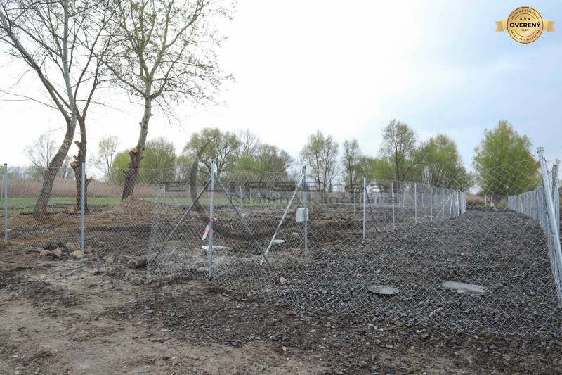 Building plot fenced with a wire fence in Zohor on Nad potokom street.