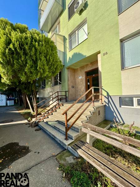 Entrance to the apartment building in Topoľčany with passage to the studio apartment.