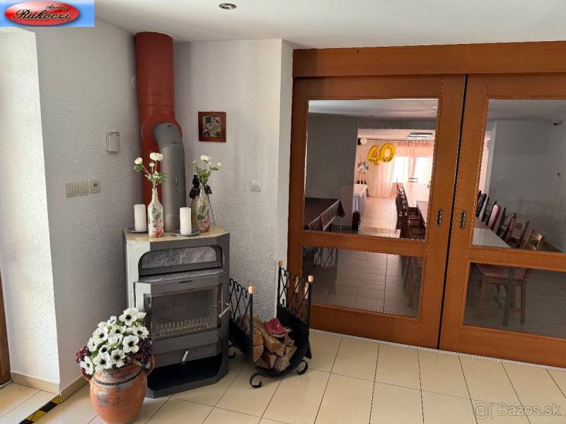 A fireplace in commercial premises with decorations and a view of the celebration room.