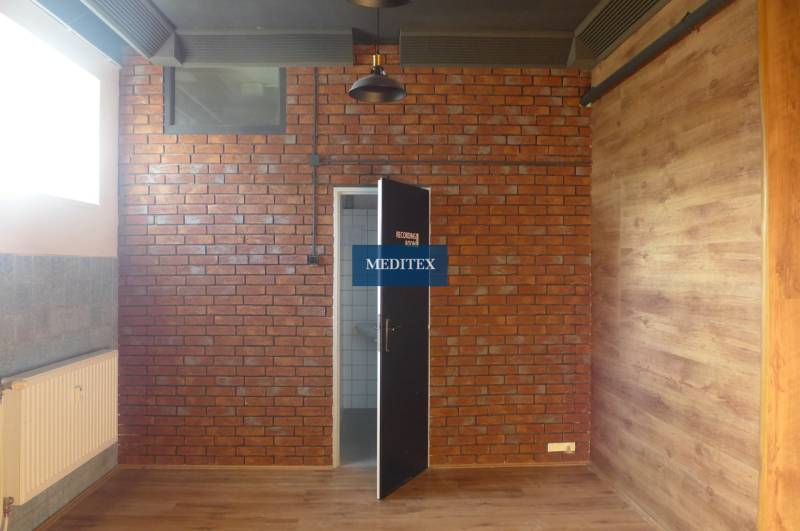 Brick wall, wooden decor floor, entrance to the room in warehouses and halls.