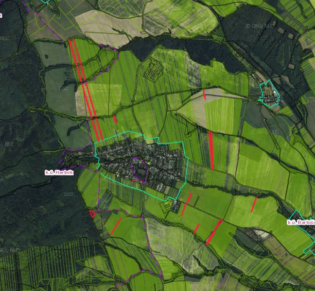 Map of agricultural and forest land around Hertník with marked parcel boundaries.