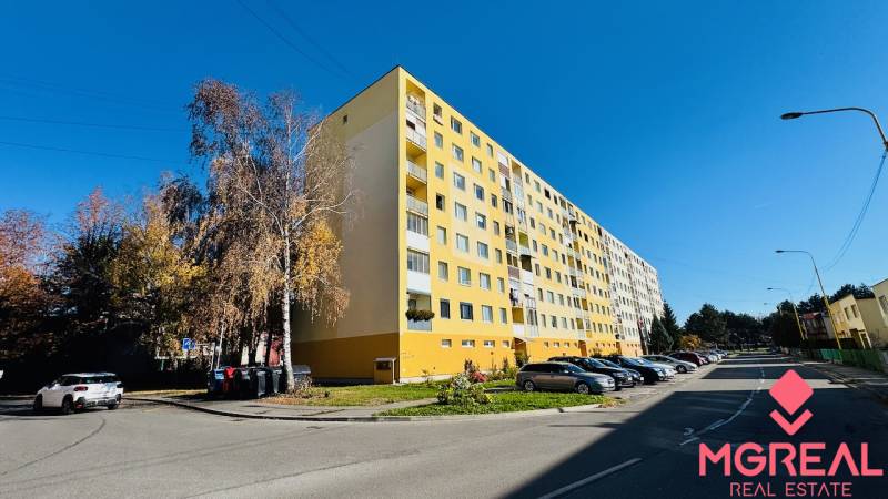 The yellow apartment building on I. Krasko Street in Prievidza, designated for 4-room apartments.