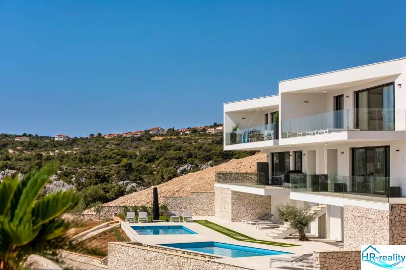 A holiday apartment in Rogoznica with a pool and terrace, countryside view.