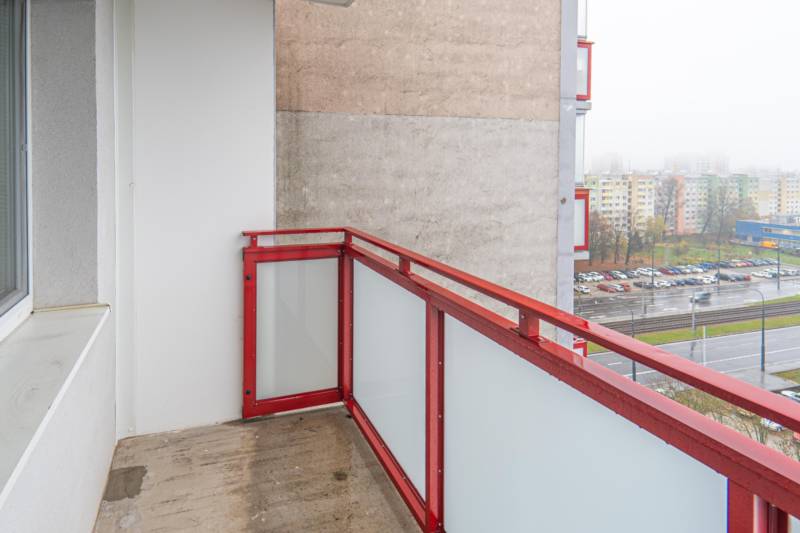 A balcony with a red railing, view of Drobného Street in Bratislava - Dúbravka.