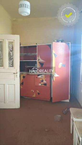 Colorful children's room in a family house with an unconventional wardrobe and carpet.