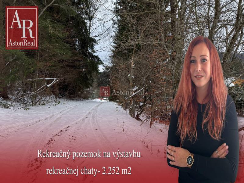 Snowy path on the Recreational Grounds in Čertov, Lazy pod Makytou, surrounded by forest vegetation.