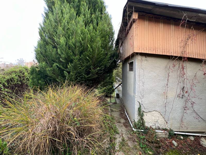 A cottage on Pod Srdcom Street in Bratislava - Devínska Nová Ves, surrounded by greenery and trees.