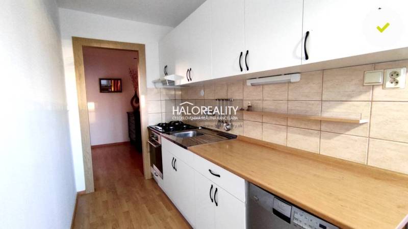 The kitchen and 2-room apartment offer a functional design, light wood, white cabinets.