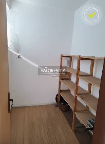Pantry with a light shelf and a wooden decor floor in a 3-room apartment.