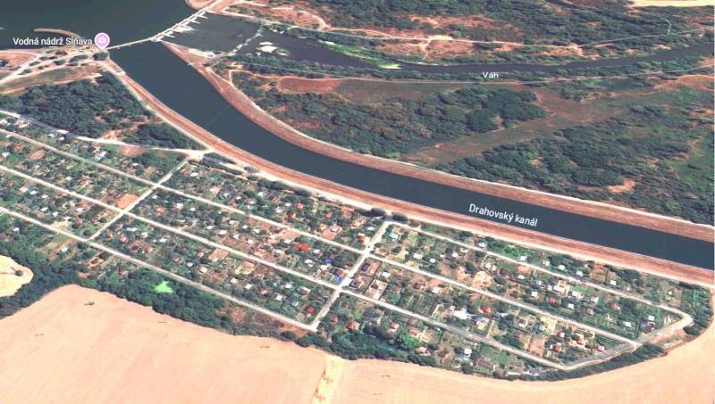 Aerial view of recreational plots in Drahovce near the Drahovce Canal and the Váh River.