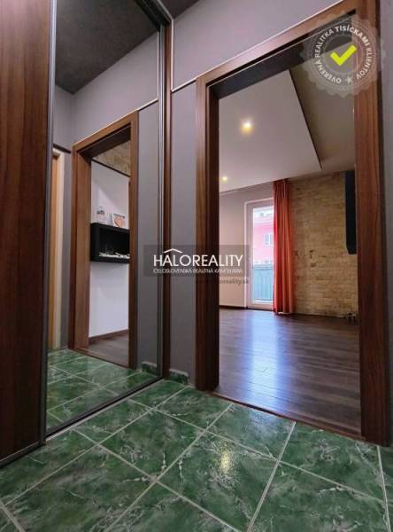 In the 2-room apartment, you can see a hallway with a green ceramic floor.