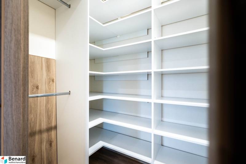 Built-in wardrobe with shelves and a hanging rod in a 2-room apartment.
