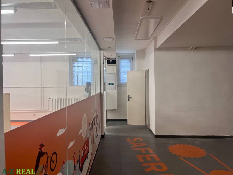Interior of commercial spaces with graphic decorations on the partition and floor.