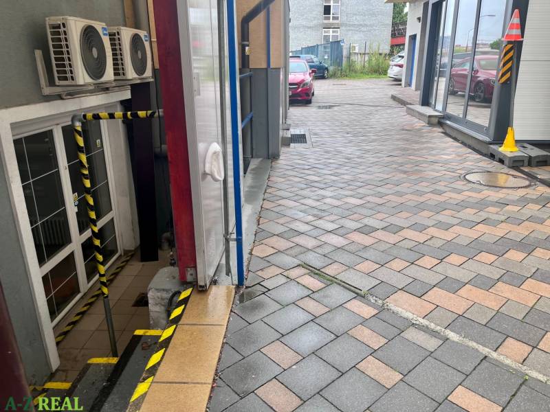 Paved sidewalk in front of commercial premises on Račianska Street in Bratislava - Nové Mesto.