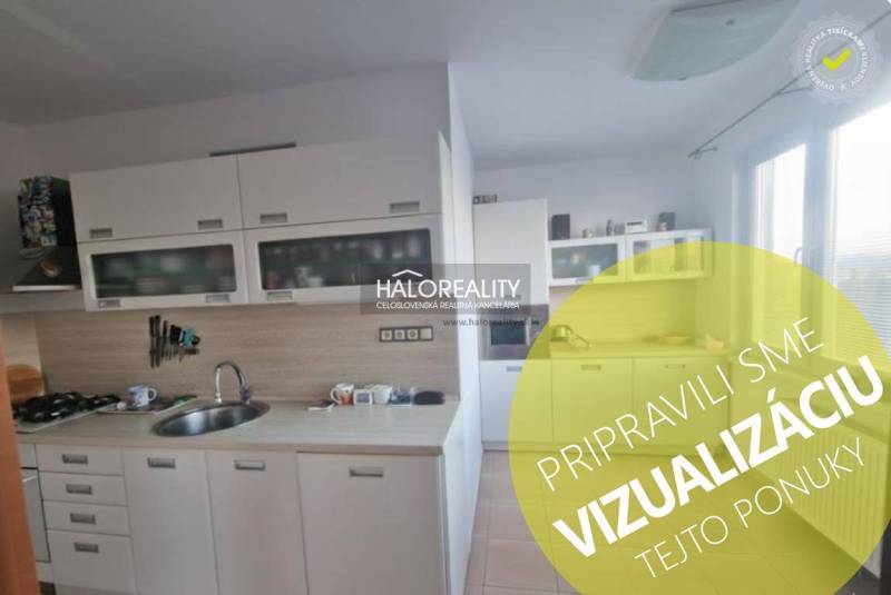 A kitchen in a 3-room apartment with white cabinets and a gas stove.