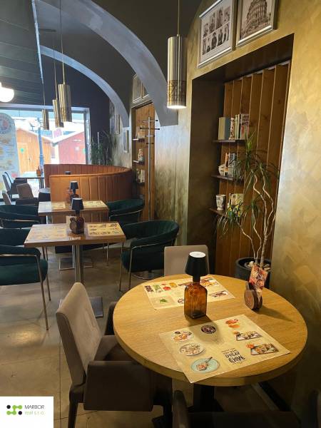 Interior of gastro spaces with wooden decor and wall decorations.