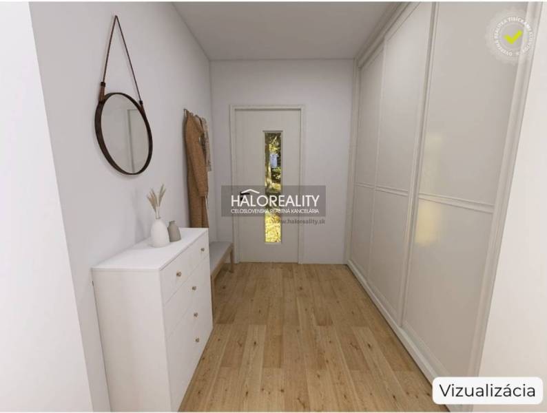 Interior of a family house with a wooden decor floor, a white dresser, and a mirror.