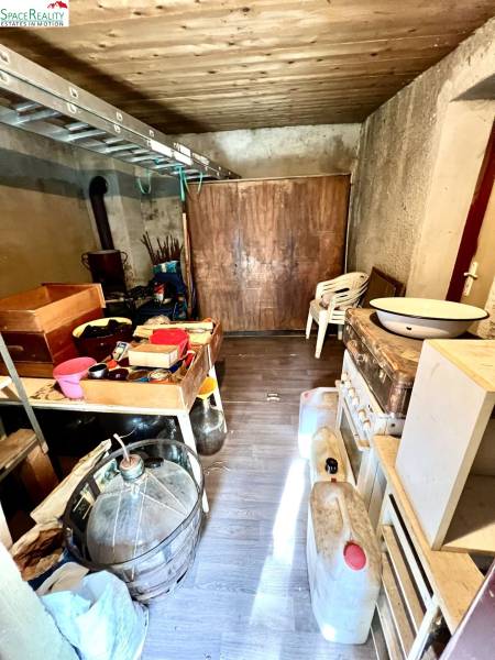 A warehouse with various equipment and a wooden decor floor in a family house.