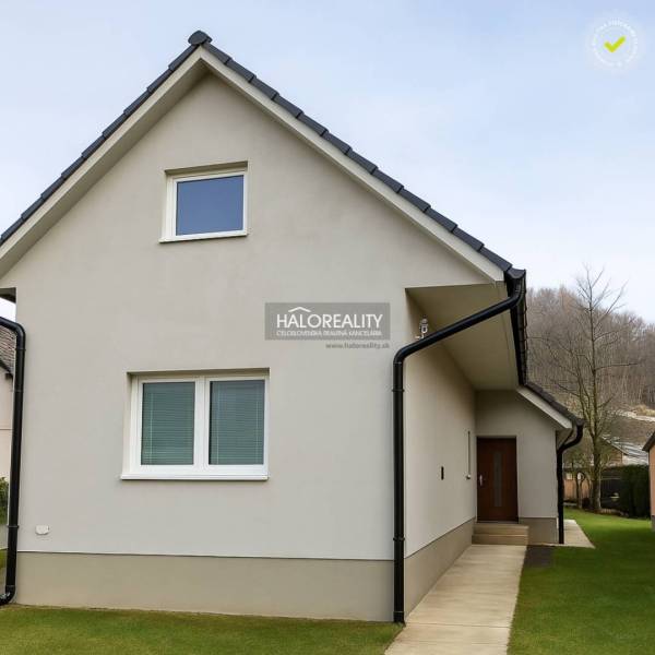 A family house in Kľačno with an attic and grassy surroundings.