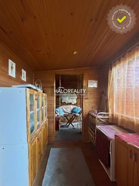 Interior with garden furniture, wooden decor, pleasant lighting, ideal for relaxation in the Gardens.