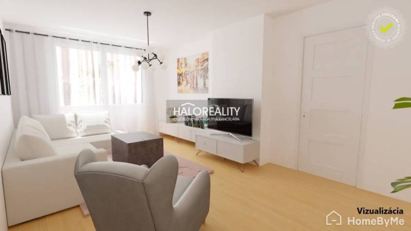 Living room with white furniture and a television in a three-room apartment.