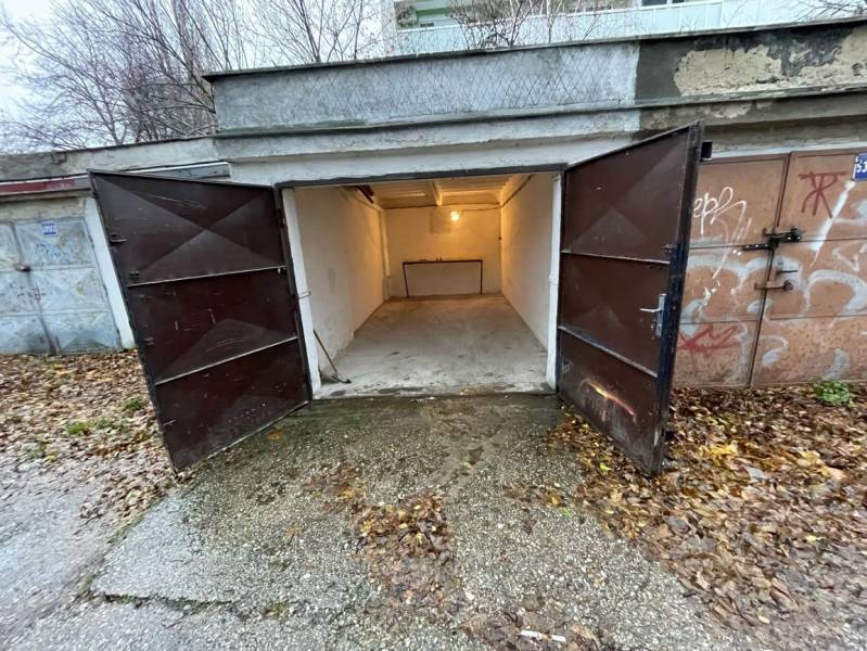 Open garages on Priekopy Street in Bratislava - Ružinov, surrounded by autumn leaves.