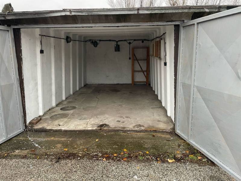 Open garages on Prístavná Street in Bratislava - Ružinov with a bare concrete floor.