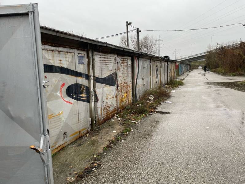 Garages on Prístavná Street in Bratislava - Ružinov with rectangular metal doors.