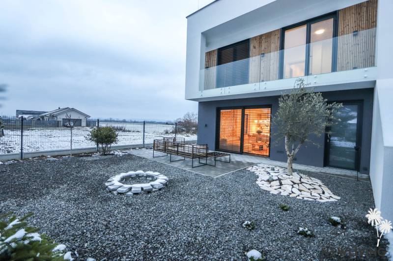 Family house in Modrovka on Modrovka Street with a terrace and a gravel yard.