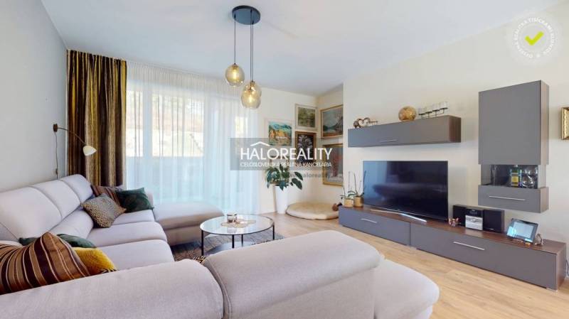 Living room in a family house with a comfortable sofa and a wooden decor floor.